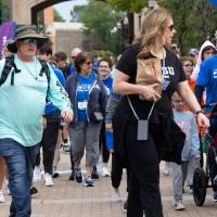 Participants walking by at the start of the event